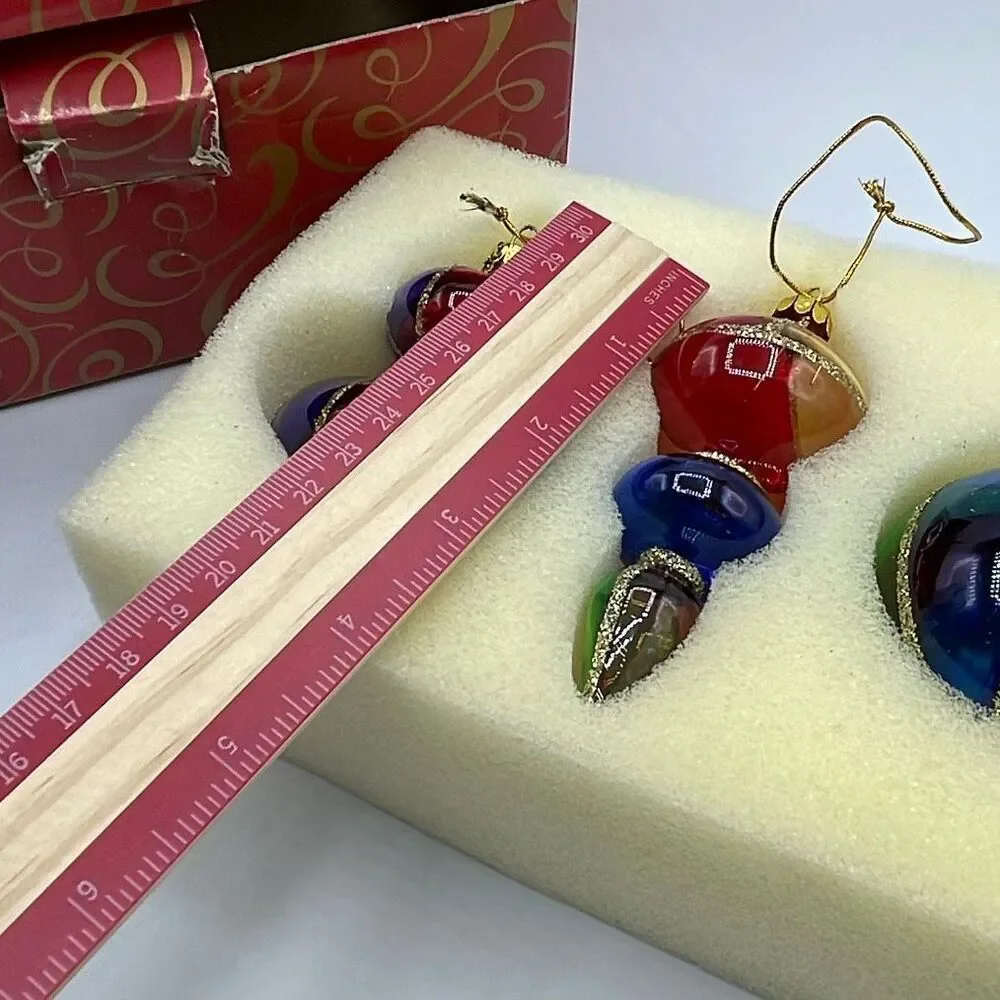 Vintage Avon 2001 Holiday Treasures blown glass ornaments.